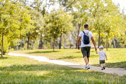 CANUE | Environment + Health: Data 101 Seminar Series: April 21st | 2021 | 10am pacific | 1pm easternFamily walk in nature, hiking. A father and son are walking thro